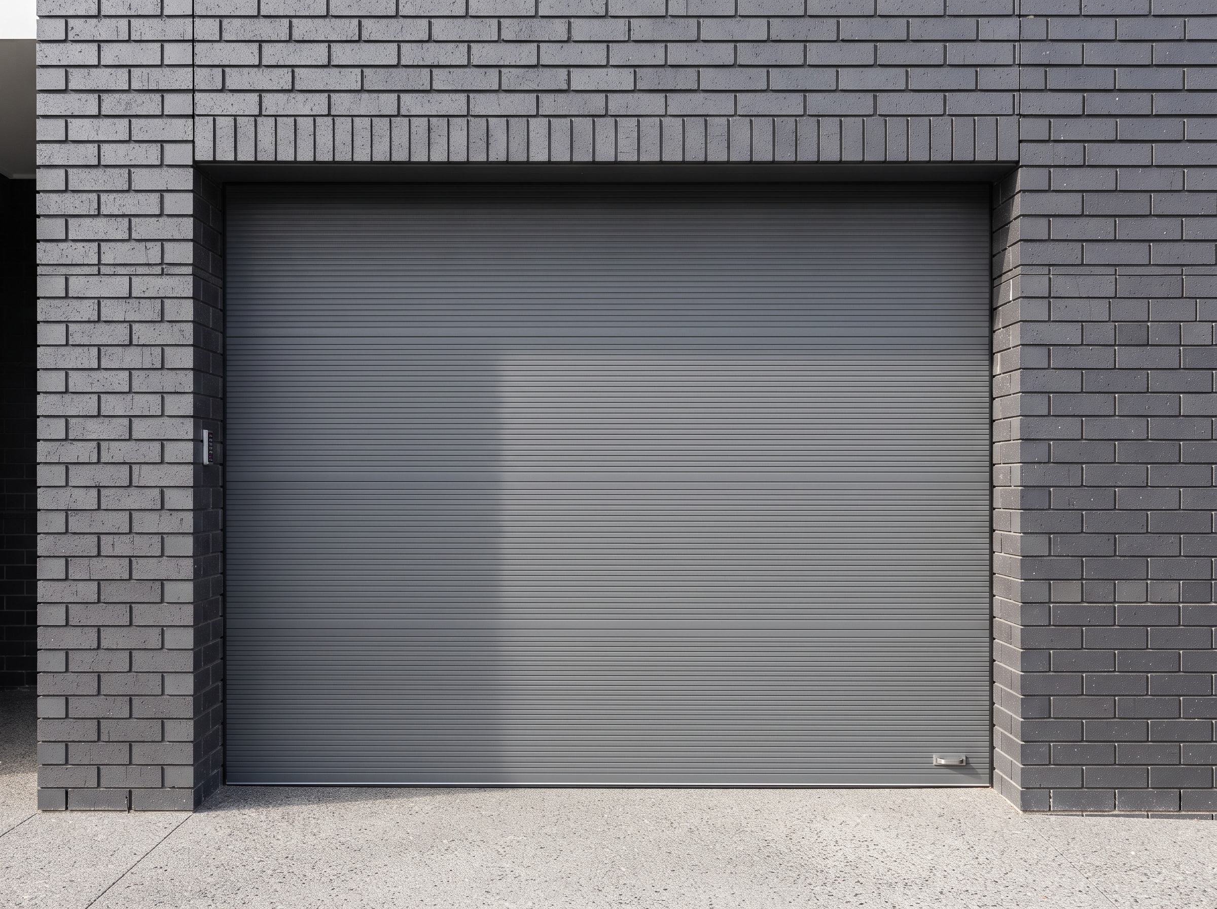 Réparation porte de garage sectionnelle à Mons